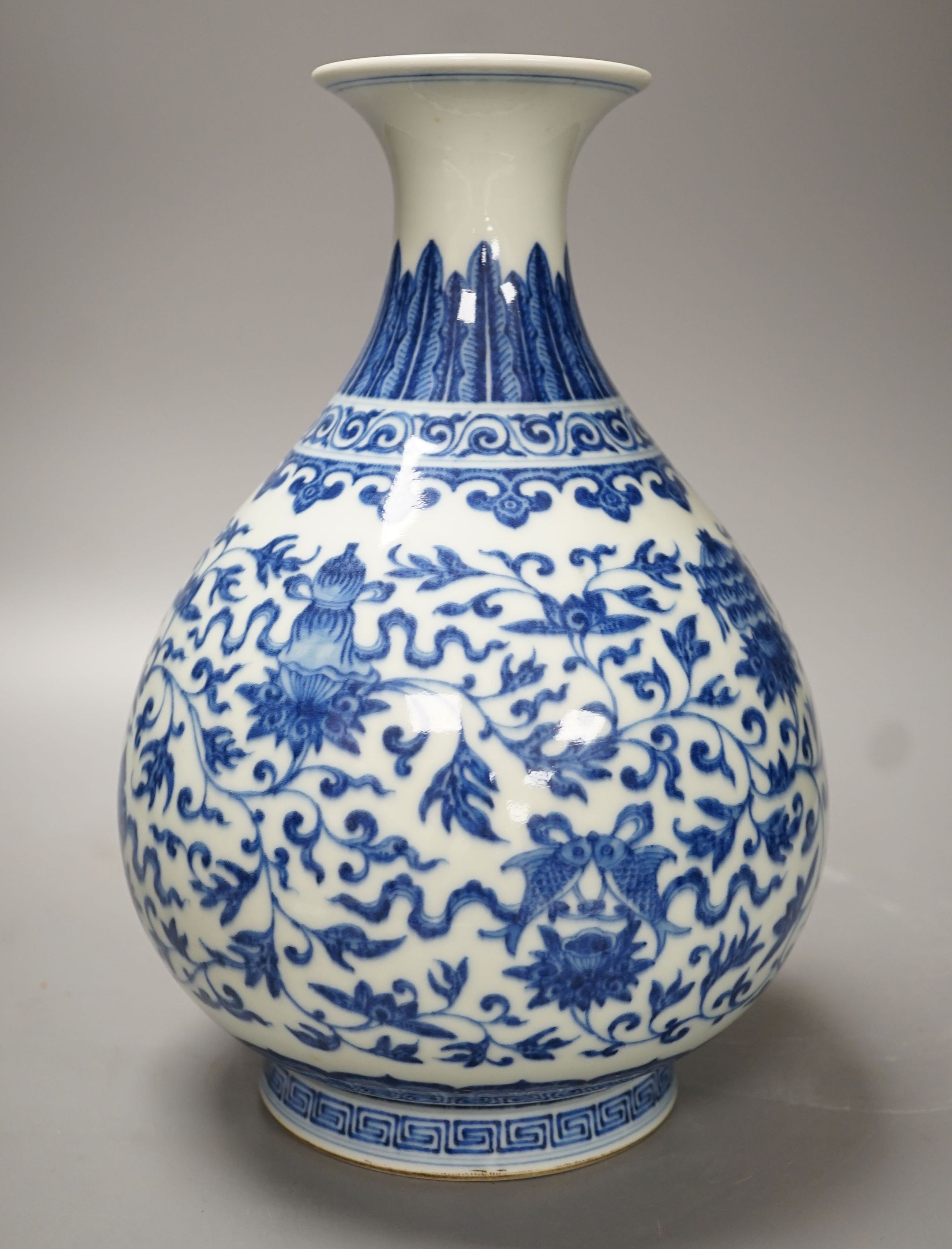 A Chinese blue and white Ming style 'lotus' vase, Yuhuchunping, Qianlong seal mark but 19th century - 28cm high